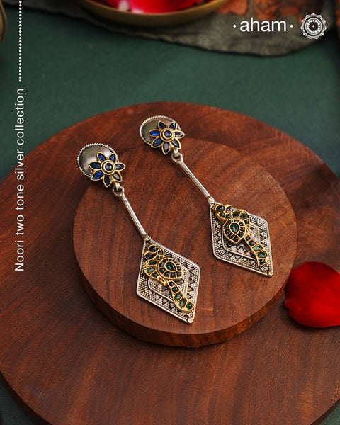 Noori two tone Earrings. The earrings are handcrafted in 92.5 sterling silver with gold highlights. Style this up with your favourite ethnic or fusion outfits to complete the look.