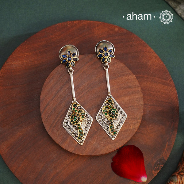 Noori two tone Earrings. The earrings are handcrafted in 92.5 sterling silver with gold highlights. Style this up with your favourite ethnic or fusion outfits to complete the look.