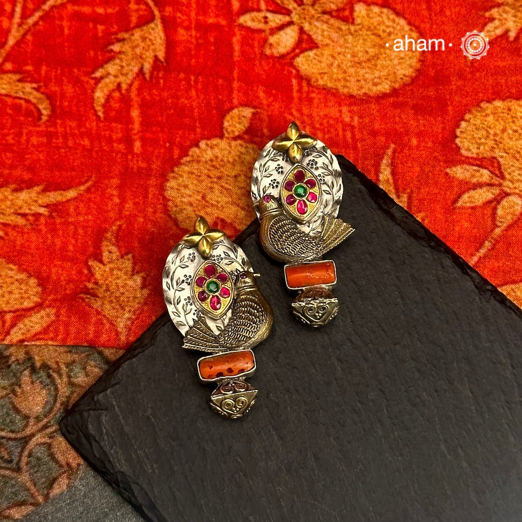 Noori two tone Earrings. The earrings are handcrafted in 92.5 sterling silver with gold highlights. Style this up with your favourite ethnic or fusion outfits to complete the look.