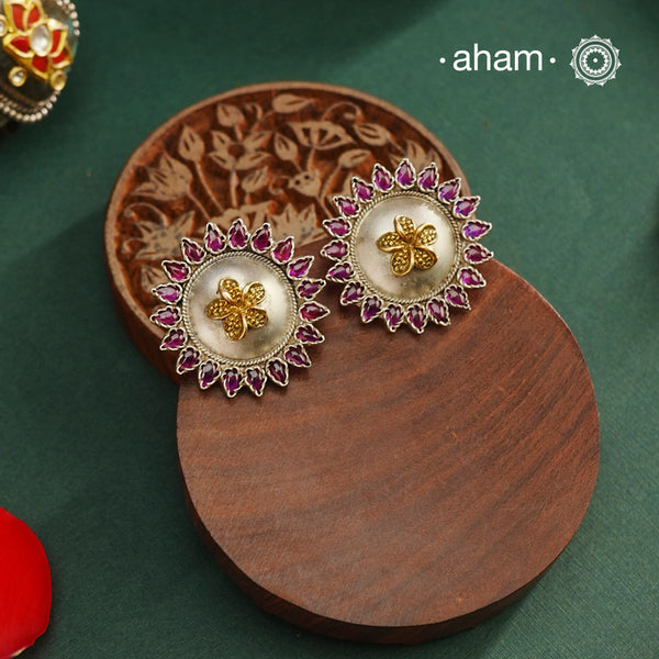Noori two tone Earrings. The earrings are handcrafted in 92.5 sterling silver with gold highlights and pink stones. Style this up with your favourite ethnic or fusion outfits to complete the look.