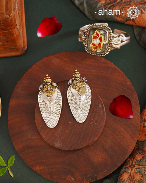 Noori two tone Earrings. The earrings are handcrafted in 92.5 sterling silver with gold highlights. Style this up with your favourite ethnic or fusion outfits to complete the look.