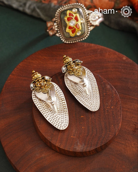 Noori two tone Earrings. The earrings are handcrafted in 92.5 sterling silver with gold highlights. Style this up with your favourite ethnic or fusion outfits to complete the look.