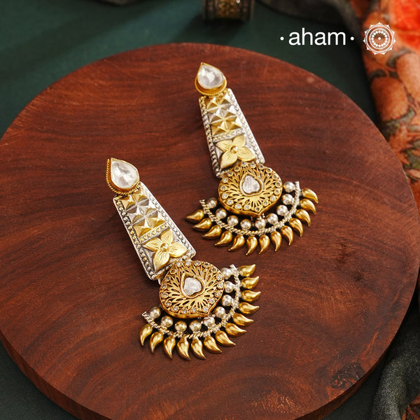 Noori two tone Earrings. The earrings are handcrafted in 92.5 sterling silver with gold highlights. Style this up with your favourite ethnic or fusion outfits to complete the look.