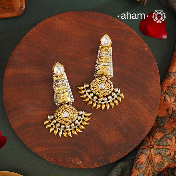 Noori two tone Earrings. The earrings are handcrafted in 92.5 sterling silver with gold highlights. Style this up with your favourite ethnic or fusion outfits to complete the look.