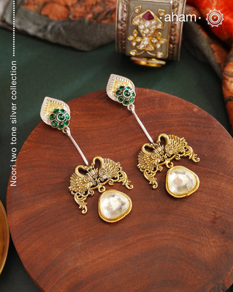 Noori Two Tone Double Swan Silver Earrings with quartz polki drop. The earrings are handcrafted in 92.5 sterling silver with gold highlights. Style this up with your favourite ethnic or fusion outfits to complete the look.