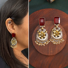 Noori two tone Earrings. The earrings are handcrafted in 92.5 sterling silver with gold highlights and a beautiful red stone feature. Style this up with your favourite ethnic or fusion outfits to complete the look.