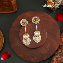 Discover the perfect accessory for all your Indian and fusion outfits with our Noori Two Tone Silver Earrings. Crafted in 92.5 silver, these long and lightweight earrings feature subtle design elements and dual tones for a versatile and stylish look. Elevate your style game with these beautiful earrings.