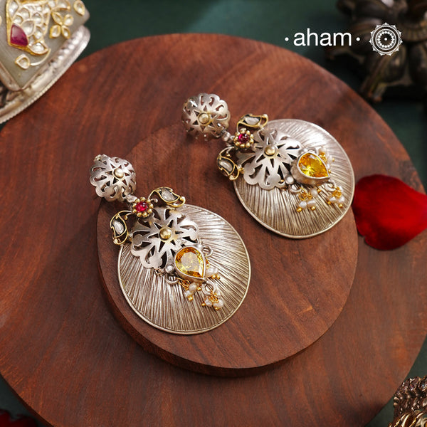 Noori two tone Earrings. The earrings are handcrafted in 92.5 sterling silver with gold highlights. Style this up with your favourite ethnic or fusion outfits to complete the look.