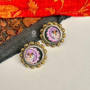 Handpainted Nandi studs in pichwai style set in 92.5 silver with dual tones. Style this up with your favourite ethnic or fusion outfits to complete the look.