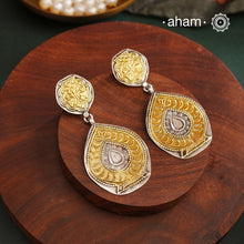 Light weight Noori two tone earrings handcrafted in 92.5 sterling silver with gold highlights. Style this up with your favourite ethnic or fusion outfits to complete the look.Light weight Noori two tone earrings handcrafted in 92.5 sterling silver with gold highlights. Style this up with your favourite ethnic or fusion outfits to complete the look.