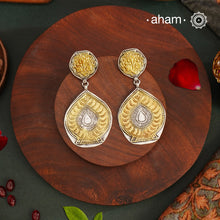 Light weight Noori two tone earrings handcrafted in 92.5 sterling silver with gold highlights. Style this up with your favourite ethnic or fusion outfits to complete the look.