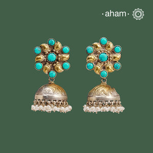 Noori two tone Jhumkie. The earrings are handcrafted in 92.5 sterling silver with gold tones and turquoise highlights. Style this up with your favourite ethnic or fusion outfits to complete the look.