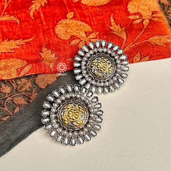 Statement Noori two tone Earrings. The earrings are handcrafted in 92.5 sterling silver with gold highlights. Style this up with your favourite ethnic or fusion outfits to complete the look.