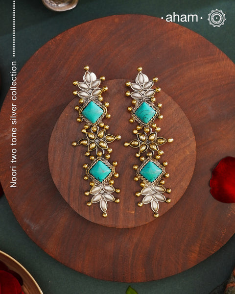 Noori two tone Earrings. The earrings are handcrafted in 92.5 sterling silver with gold highlights and turquoise stone setting. Long yet lightweight, perfect to style this up with your favourite ethnic or fusion outfits to complete the look..