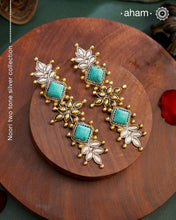 Noori two tone Earrings. The earrings are handcrafted in 92.5 sterling silver with gold highlights and turquoise stone setting. Long yet lightweight, perfect to style this up with your favourite ethnic or fusion outfits to complete the look..