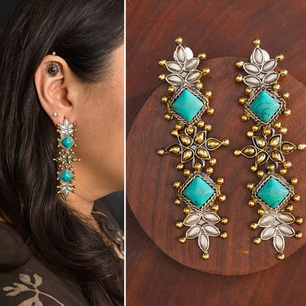 Noori two tone Earrings. The earrings are handcrafted in 92.5 sterling silver with gold highlights and turquoise stone setting. Long yet lightweight, perfect to style this up with your favourite ethnic or fusion outfits to complete the look..