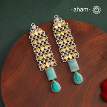 Noori two tone handcrafted in 92.5 sterling silver with gold highlights and turquoise drop. Style this up with your favourite ethnic or fusion outfits to complete the look.