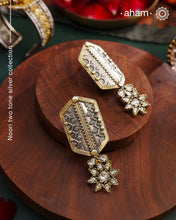 Noori two tone Earrings. The earrings are handcrafted in 92.5 sterling silver with gold highlights and fine rava work. Style this up with your favourite ethnic or fusion outfits to complete the look.