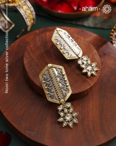 Noori two tone Earrings. The earrings are handcrafted in 92.5 sterling silver with gold highlights and fine rava work. Style this up with your favourite ethnic or fusion outfits to complete the look.