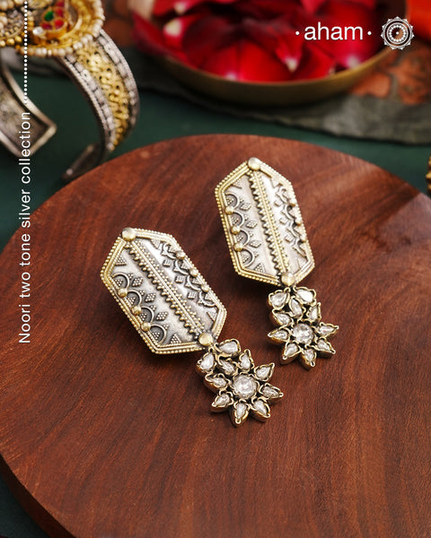 Noori two tone Earrings. The earrings are handcrafted in 92.5 sterling silver with gold highlights and fine rava work. Style this up with your favourite ethnic or fusion outfits to complete the look.