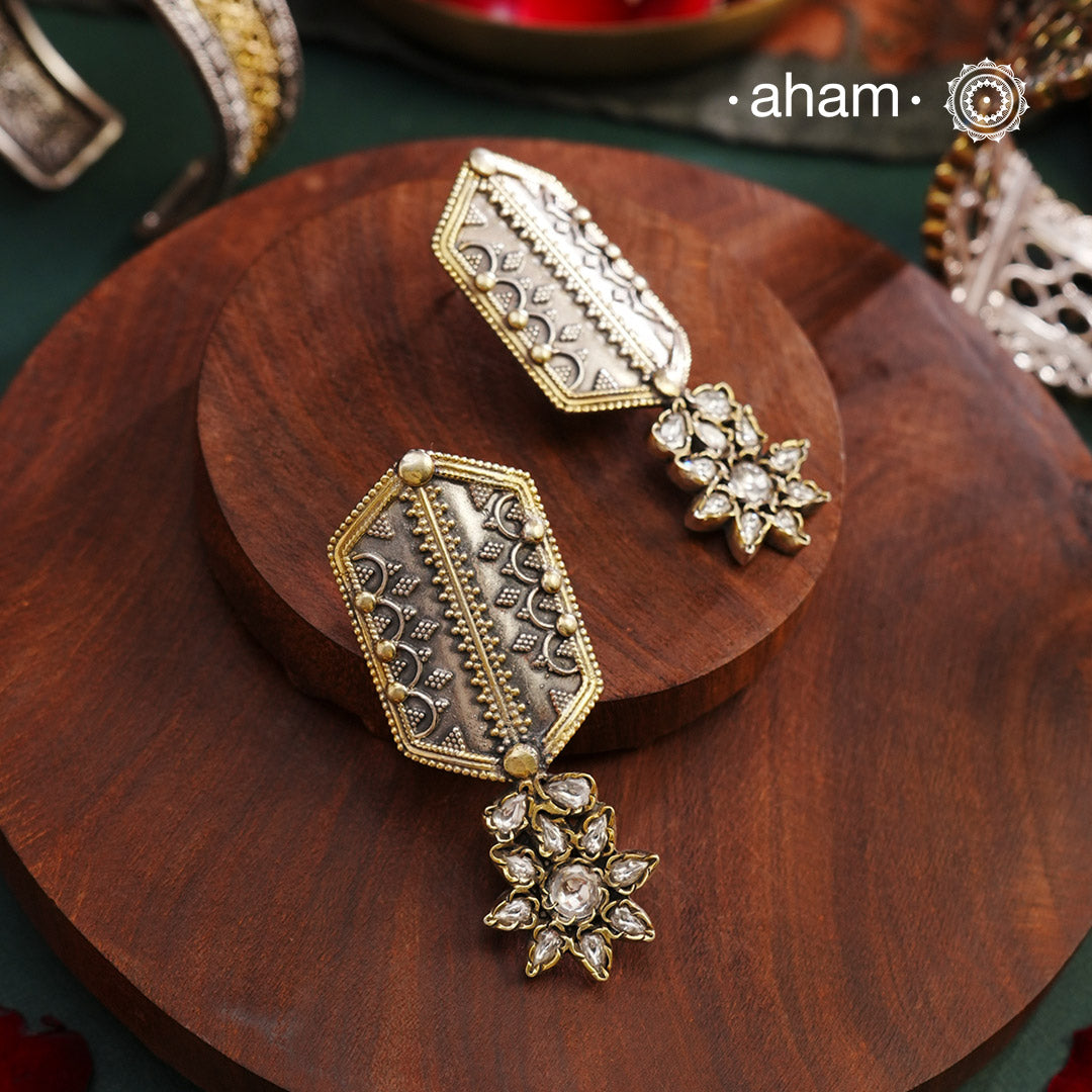 Noori two tone Earrings. The earrings are handcrafted in 92.5 sterling silver with gold highlights and fine rava work. Style this up with your favourite ethnic or fusion outfits to complete the look.