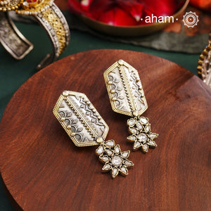 Noori two tone Earrings. The earrings are handcrafted in 92.5 sterling silver with gold highlights and fine rava work. Style this up with your favourite ethnic or fusion outfits to complete the look.