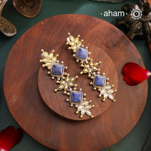 Noori two tone Earrings. The earrings are handcrafted in 92.5 sterling silver with gold highlights and blue stone setting. Long yet lightweight, perfect to style this up with your favourite ethnic or fusion outfits to complete the look.