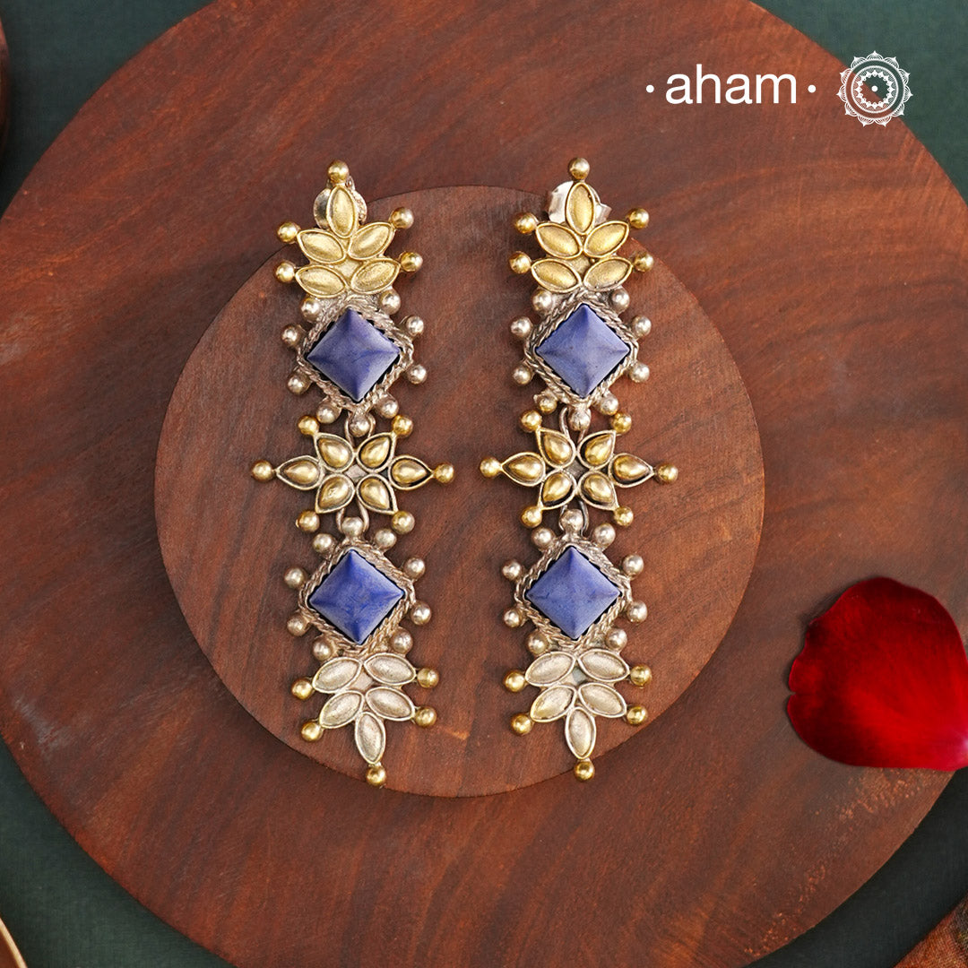 Noori two tone Earrings. The earrings are handcrafted in 92.5 sterling silver with gold highlights and blue stone setting. Long yet lightweight, perfect to style this up with your favourite ethnic or fusion outfits to complete the look.