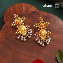 Enhance your style with the timeless elegance of the Dual Tone Silver Earrings. Handcrafted by skilled karigars in Barmer, Rajasthan, this earring features traditional Bandhel work, where a thin sheet of hand beaten 22 carat gold is set on 92.5 silver using a unique wax filling technique. A classic representation of Indian craftsmanship.