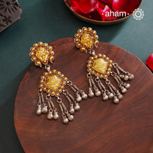 Enhance your style with the timeless elegance of the Dual Tone Silver Earrings. Handcrafted by skilled karigars in Barmer, Rajasthan, this earring features traditional Bandhel work, where a thin sheet of hand beaten 22 carat gold is set on 92.5 silver using a unique wax setting technique. A classic representation of Indian craftsmanship.