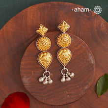 Enhance your style with the timeless elegance of the Dual Tone Silver Earrings. Handcrafted by skilled karigars in Barmer, Rajasthan, this earring features traditional Bandhel work, where a thin sheet of hand beaten 22 carat gold is set on 92.5 silver using a unique wax filling technique. A classic representation of Indian craftsmanship.