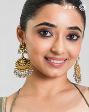 Enhance your style with the timeless elegance of the Dual Tone Silver Earrings. Handcrafted by skilled karigars in Barmer, Rajasthan, this earring features traditional Bandhel work, where a thin sheet of hand beaten 22 carat gold is set on 92.5 silver using a unique wax filling technique. A classic representation of Indian craftsmanship.&nbsp;