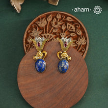 Noori two tone Earrings. The earrings are handcrafted in 92.5 sterling silver with gold highlights and lapiz stone. Style this up with your favourite ethnic or fusion outfits to complete the look.