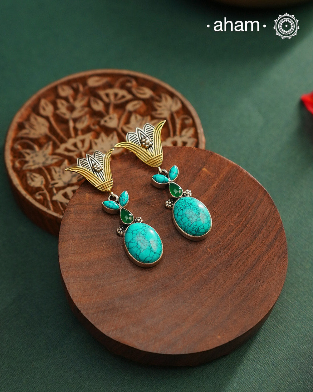 Noori two tone Earrings. The earrings are handcrafted in 92.5 sterling silver with turquoise stone and gold highlights. Style this up with your favourite ethnic or indo western outfits to complete the look.