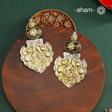 Enhance your look with our Noori Two Tone Silver Earrings! These elegant earrings feature a beautiful inlay work stone highlight with elegant peacock motifs. Crafted in 92.5 silver.
