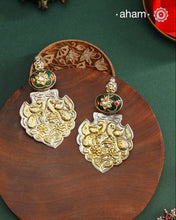 Enhance your look with our Noori Two Tone Silver Earrings! These elegant earrings feature a beautiful inlay work stone highlight with elegant peacock motifs. Crafted in 92.5 silver.