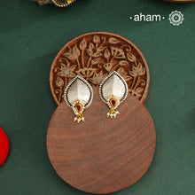 Noori two tone Earrings. The earrings are handcrafted in 92.5 sterling silver with gold highlights. Style this up with your favourite ethnic or fusion outfits to complete the look.