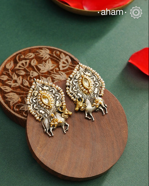 Noori dual tone Earrings. The earrings are handcrafted in 92.5 sterling silver with kundan, pearl and gold, highlights. Style this up with your favourite ethnic or fusion outfits to complete the look.