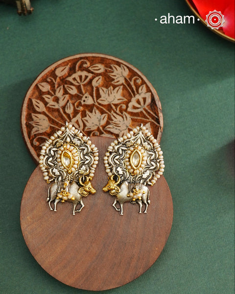 Noori dual tone Earrings. The earrings are handcrafted in 92.5 sterling silver with kundan, pearl and gold, highlights. Style this up with your favourite ethnic or fusion outfits to complete the look.