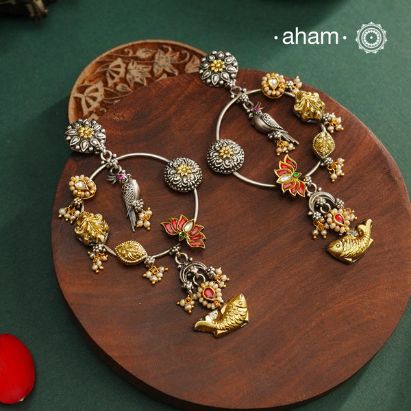 Noori two tone Earrings. The earrings are handcrafted in 92.5 sterling silver with gold kundan and pearl highlights. Style this up with your favourite ethnic or fusion outfits to complete the look.
