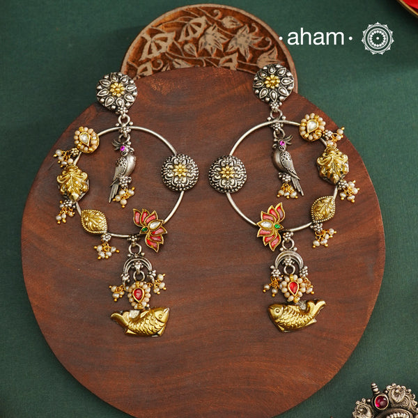Noori two tone Earrings. The earrings are handcrafted in 92.5 sterling silver with gold kundan and pearl highlights. Style this up with your favourite ethnic or fusion outfits to complete the look.