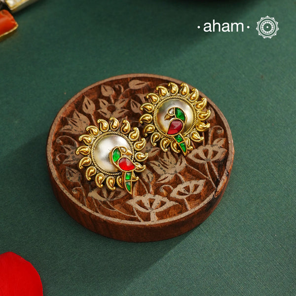 Noori two tone Parrot Earrings handcrafted in 92.5 sterling silver with gold highlights. Style this up with your favourite ethnic or fusion outfits to complete the look.