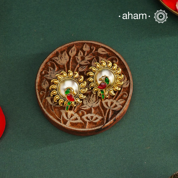Noori two tone Parrot Earrings handcrafted in 92.5 sterling silver with gold highlights. Style this up with your favourite ethnic or fusion outfits to complete the look.
