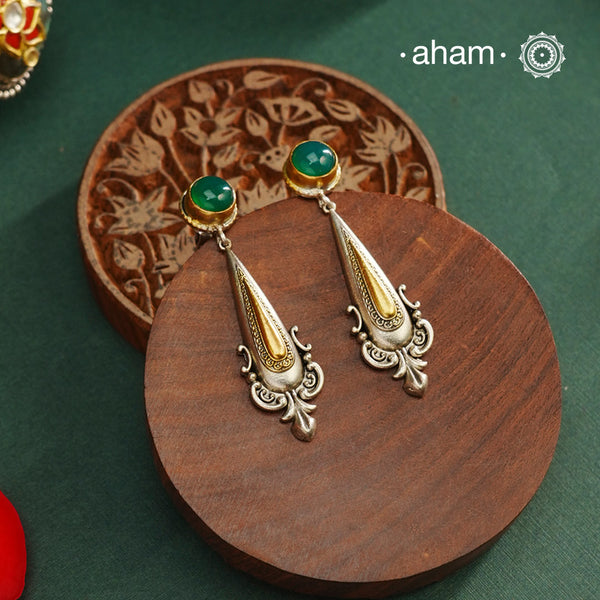 Noori two tone Earrings. The earrings are handcrafted in 92.5 sterling silver with gold highlights. Style this up with your favourite ethnic or fusion outfits to complete the look.