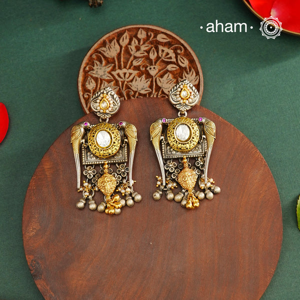 Noori dual tone parrot Earrings. The earrings are handcrafted in 92.5 sterling silver with kudan, pearl and  gold highlights. Style this up with your favourite ethnic or fusion outfits to complete the look.