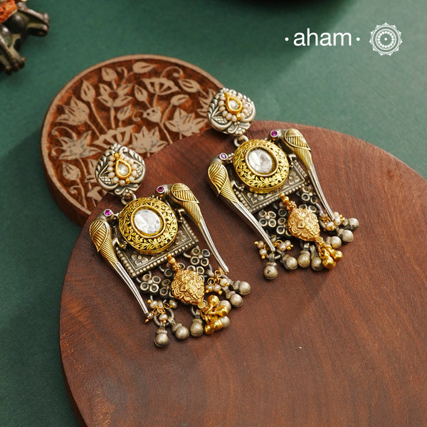 Noori dual tone parrot Earrings. The earrings are handcrafted in 92.5 sterling silver with kudan, pearl and&nbsp; gold highlights. Style this up with your favourite ethnic or fusion outfits to complete the look.