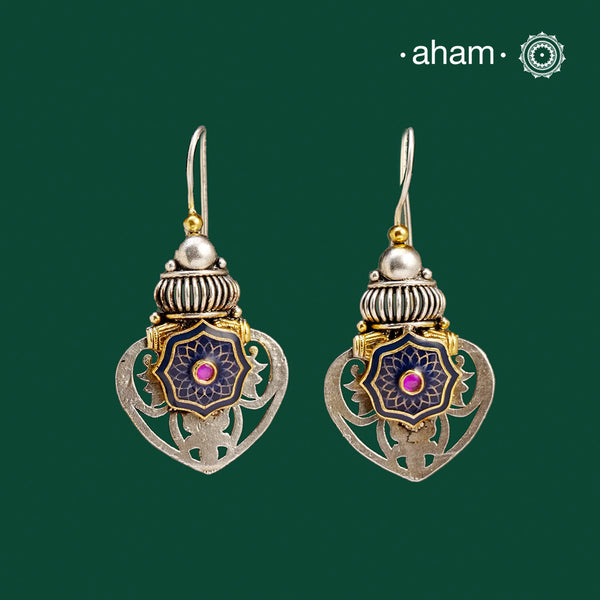 Noori two tone Earrings. The earrings are handcrafted in 92.5 sterling silver with gold tones and stunning enamel highlight in the center.Style this up with your favourite ethnic or fusion outfits to complete the look.