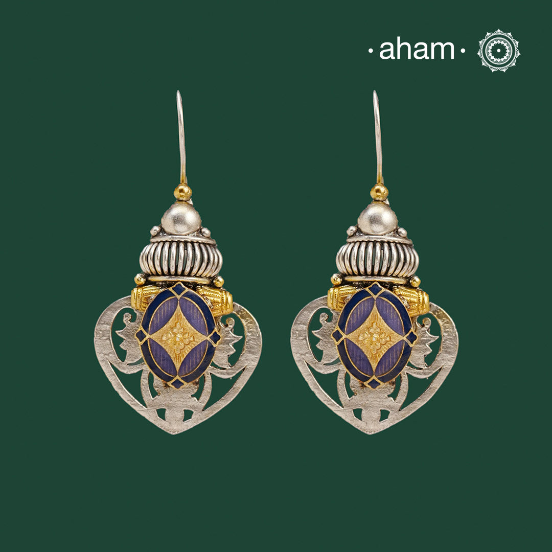 Noori two tone Earrings. The earrings are handcrafted in 92.5 sterling silver with gold tones and stunning enamel highlight in the center.Style this up with your favourite ethnic or fusion outfits to complete the look