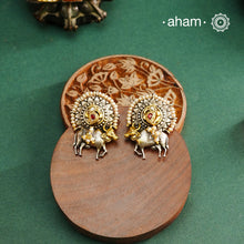 Noori dual tone cow Earrings. The earrings are handcrafted in 92.5 sterling silver with kuand, pearl and gold highlights. Style this up with your favourite ethnic or fusion outfits to complete the look.