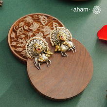 Noori dual tone cow Earrings. The earrings are handcrafted in 92.5 sterling silver with kuand, pearl and gold highlights. Style this up with your favourite ethnic or fusion outfits to complete the look.